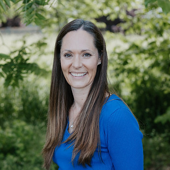 Jodi Kolb smiles at the camera.