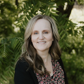 Jill Jimenez smiles at the camera.