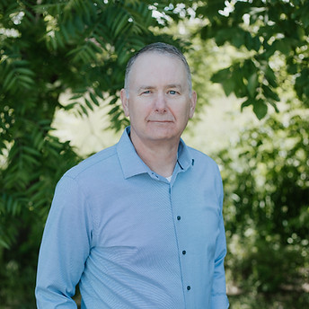 Mike Clark smiling at the camera.
